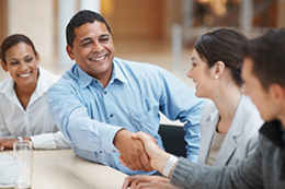 An attorney shaking hands with a client