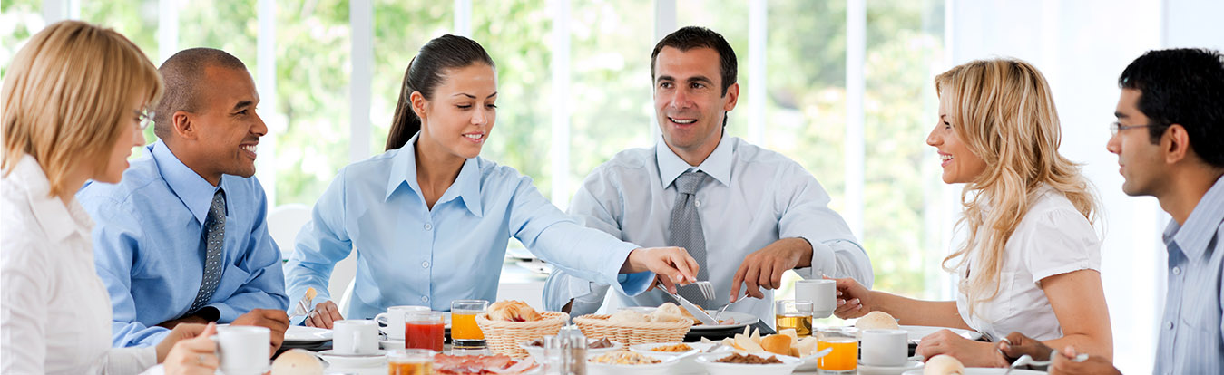 Male and female lawyers meeting over lunch