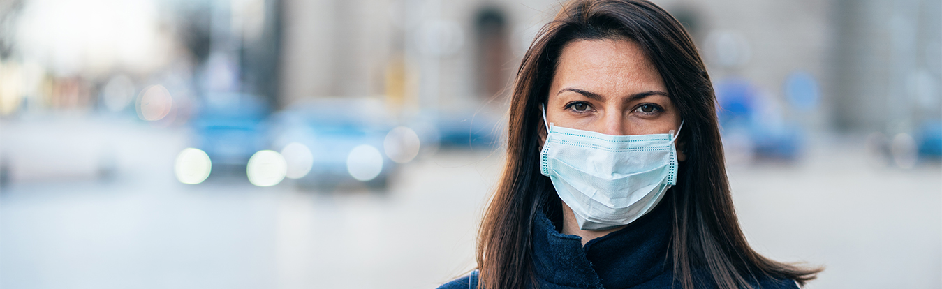 A female attorney wearing a face mask