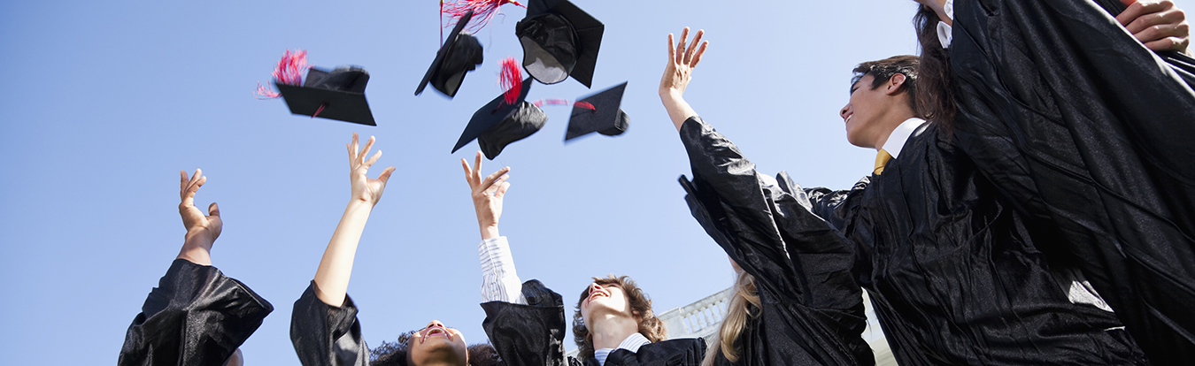 Graduates tossing morter boards