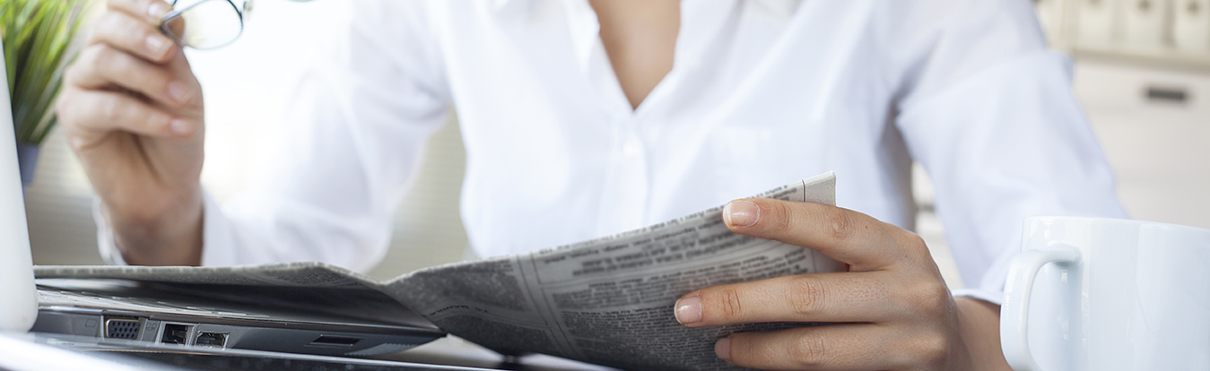 Woman reading a newspaper