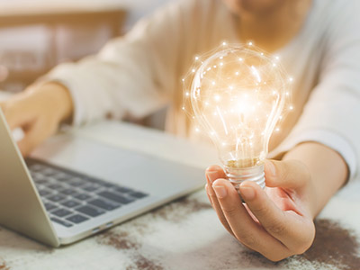 Woman holding a lightbulb